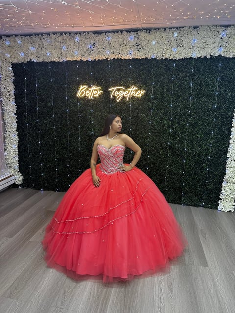 Woman in red ball gown with Better Together sign
