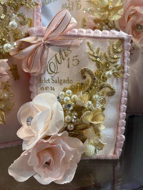Ornate gift box with pink ribbon