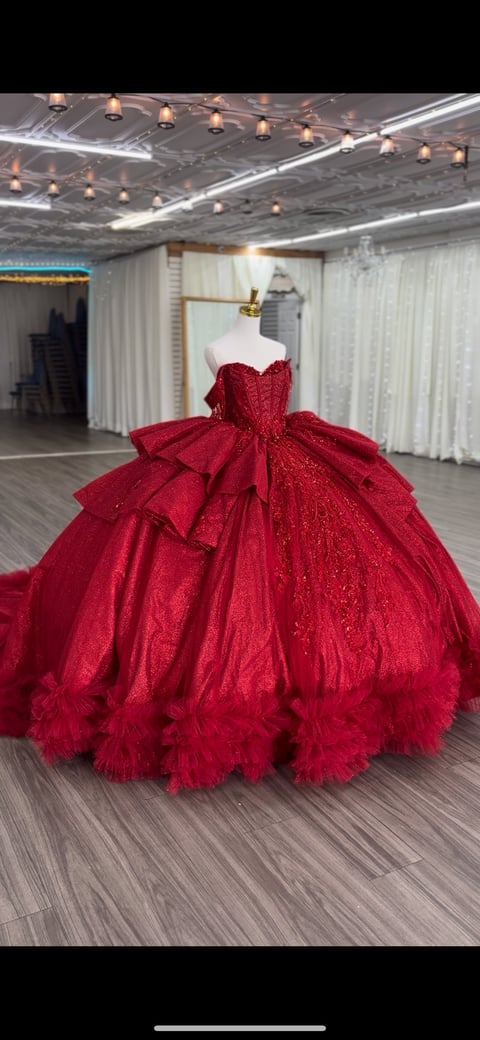 Red sequined ball gown on mannequin